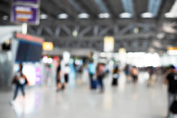 Blurry background of airport with crowd people. Abstract concept. Business traveling and vacation theme. - Photo, Image