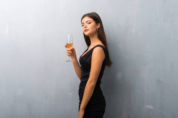 Teenager girl with champagne celebrating new year 2019 - Photo, Image