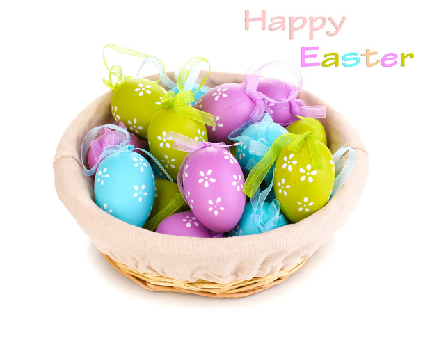 Colorful easter eggs in basket isolated on white - Фото, зображення