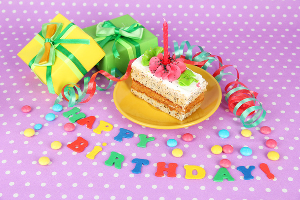 Colorful birthday cake with candle and gifts on pink background - Foto, Imagem
