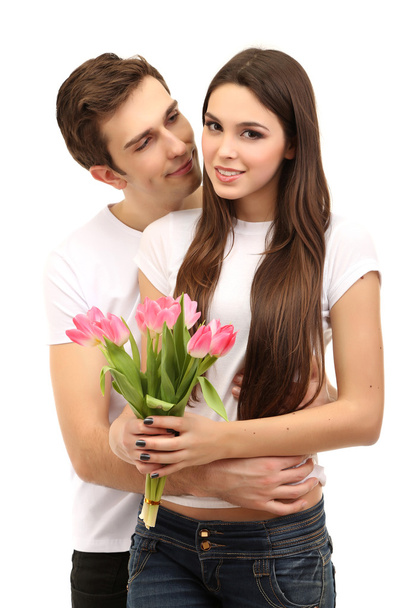 Loving couple with tulips isolated on white - Photo, image