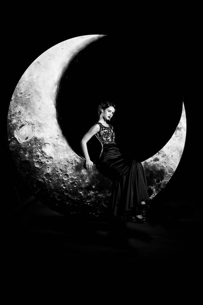 Woman in dress on moon - Foto, Imagen