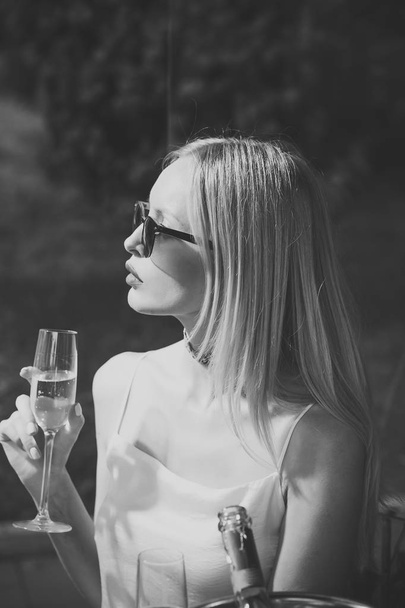 Girl with sensual red lips drink champagne in outdoor cafe - Fotografie, Obrázek