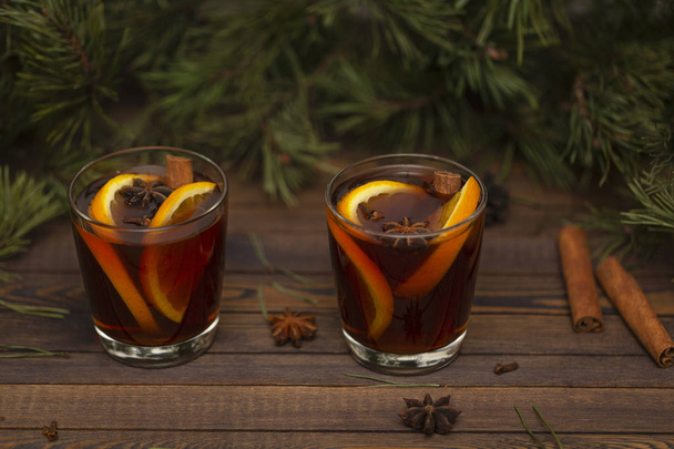 Christmas mulled wine on wooden background   - Foto, afbeelding