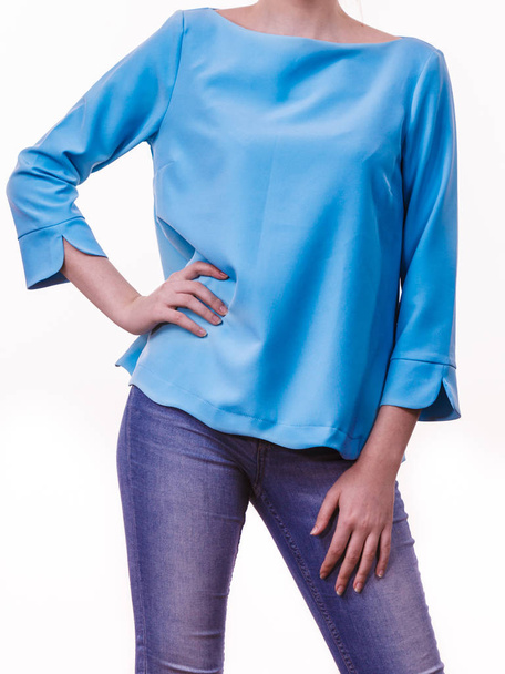 Unrecognizable woman presenting her casual beautiful outfit, long sleeved blue top and jeans. - Valokuva, kuva