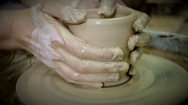 The sculptor in workshop makes jug out of clay closeup. - Footage, Video