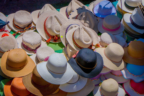above view of gorgeous an assorted handmade Panama hat of a street market in Otavalo, Ecuador - Fotografie, Obrázek