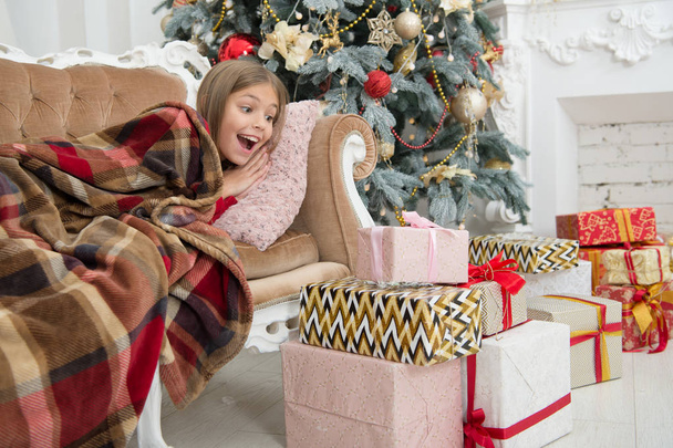 Child enjoy the holiday. Beat the Christmas rush. The morning before Xmas. Little girl. Christmas tree and presents. Happy new year. Winter. xmas online shopping. Family holiday - Φωτογραφία, εικόνα