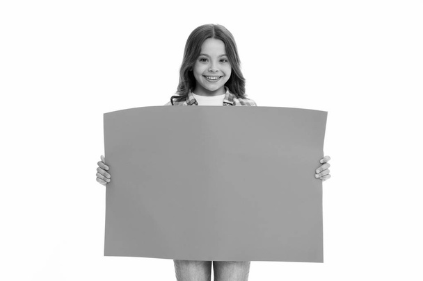 Children market advertisement. Girl kid holds blue blank surface copy space. Advertisement concept. Child cute girl looking happy while carries blue paper. Kid cheerful face sincere recommendation - Valokuva, kuva
