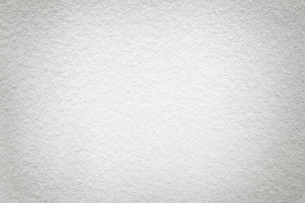 Texture of vintage light white paper background with vignette. Structure of dense gray kraft cardboard with frame. Felt ivory gradient backdrop closeup. - Photo, Image