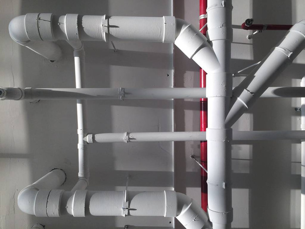 PVC Piping hanging underpass building inside the building. - Photo, Image