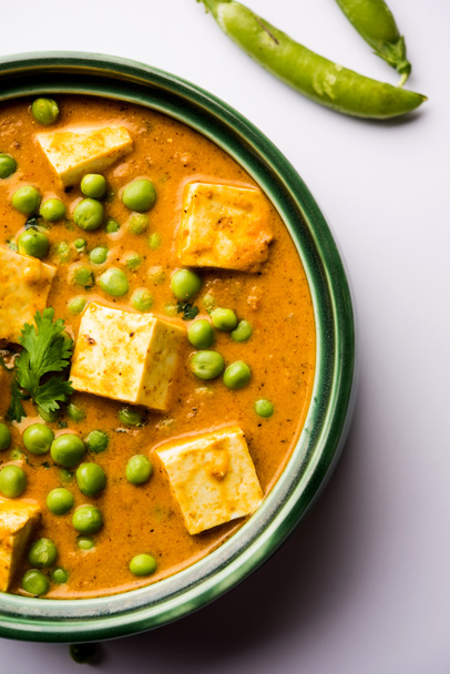 Green peas or matar paneer curry recipe, served in a bowl. selective focus - Photo, Image