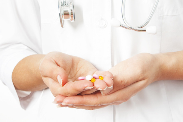 pills in a hand on a white background - Photo, Image