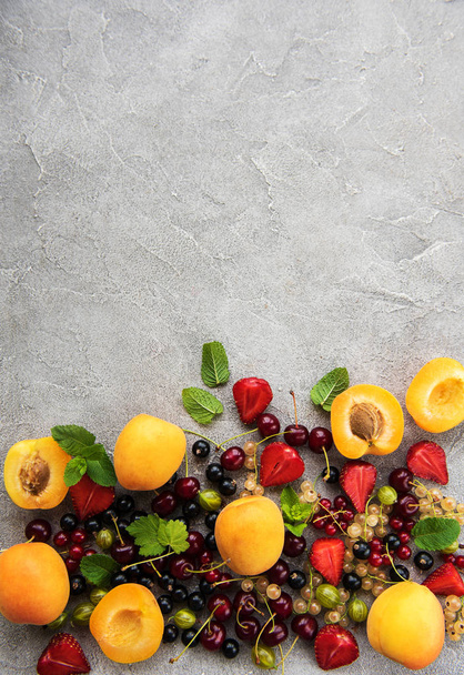 Fresh summer fruits on a concrete table - Fotoğraf, Görsel