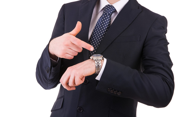 Homme d'affaires pointant sa montre-bracelet
. - Photo, image