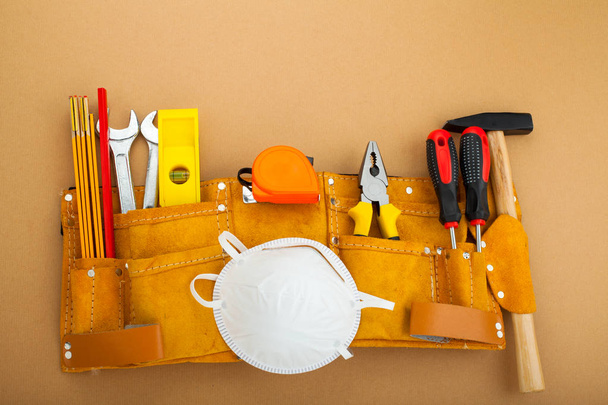 Construction equipment, tools on gradual orange background - Foto, Bild