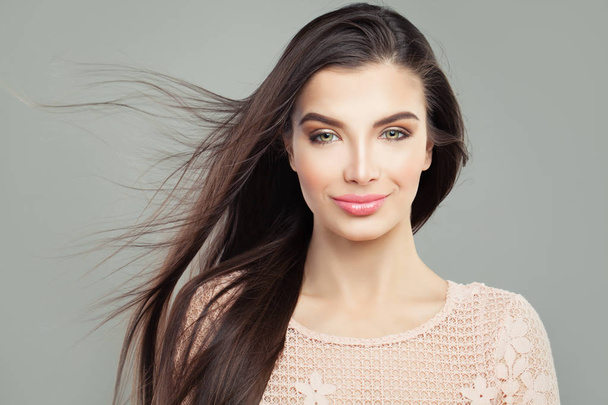 Beautiful young woman with long straight blowing hair, portrait - Photo, Image