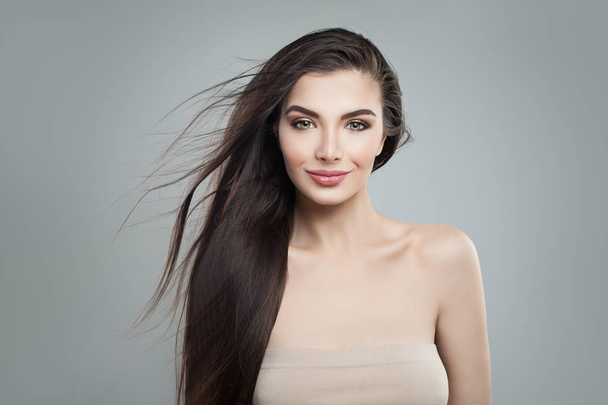 Young woman fashion model with long dark hairstyle. Makeup, long straight hair - Fotografie, Obrázek