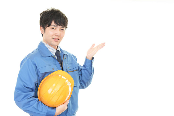 Smiling Asian worker isolated on white background - Photo, Image