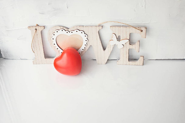 heart red and the inscription love on a white background - Fotoğraf, Görsel