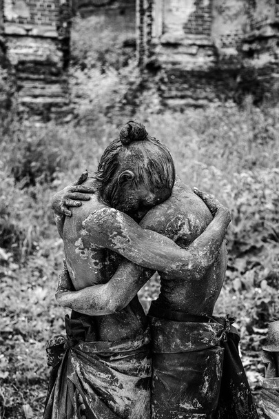 two women covered in dirt posing together outdoors - Valokuva, kuva