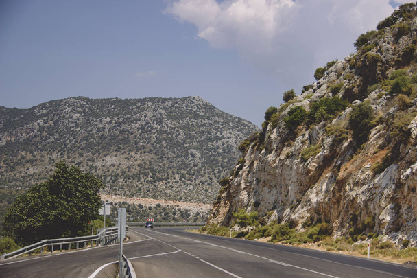 Turn of rural mountain highway in Turkey. Dangerous road in the mountains of Turkey. Traffic safety concept. - 写真・画像