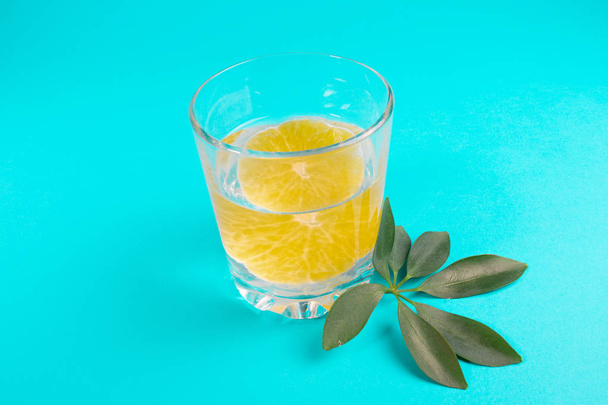 lemonade in a clear glass with orange, orange drink - Фото, зображення