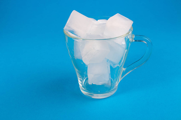 beautiful ice cubes in a transparent cup - Fotó, kép