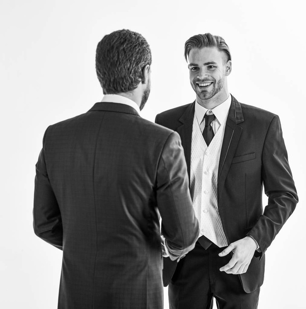 Men in suits or business partners speaking on white background. - Fotó, kép