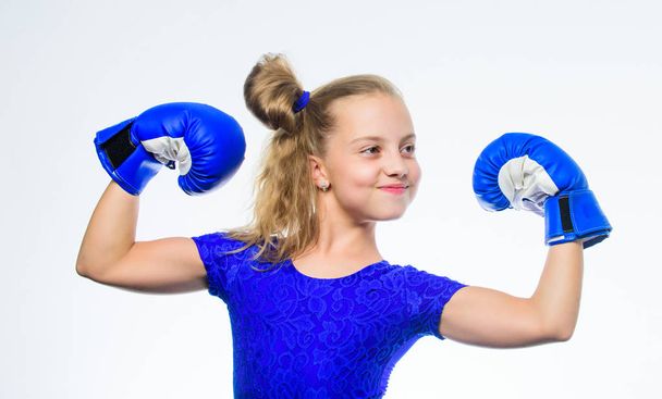 Sport and health concept. Boxing sport for female. Be strong. Girl child with blue gloves posing on white background. Sport upbringing. Upbringing for leadership and winner. Strong child boxing - Fotoğraf, Görsel