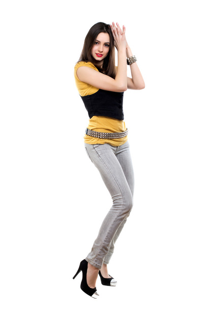 vrouw poseren in grijze jeans - Foto, afbeelding