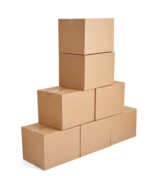 close up of  a stack of cardboard boxes on white background - 写真・画像