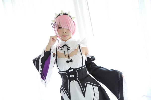 Portrait of Japan anime cosplay woman , white japanese maid in white tone room - Foto, Imagen