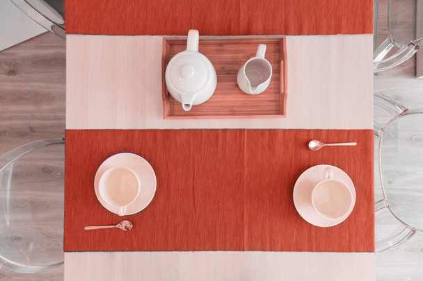 Scandinavian kitchen design. tableware in colors of the year 2019, living coral. - 写真・画像