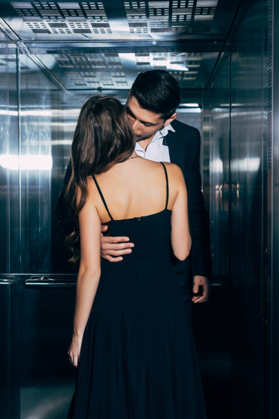 young couple passionately kissing and hugging in elevator - Photo, Image