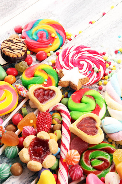 candies with jelly and sugar. colorful array of different childs sweets and treats - Photo, Image