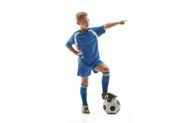 Young fit boy with soccer ball standing isolated on white - Fotoğraf, Görsel