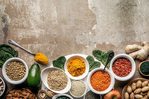 flat lay of superfoods and legumes on textured rustic background with copy space - Photo, Image
