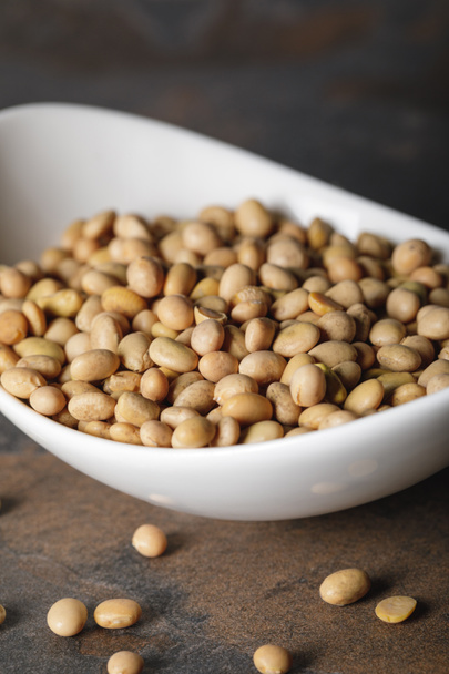 selective focus of soybean in white bowl on table - Photo, Image