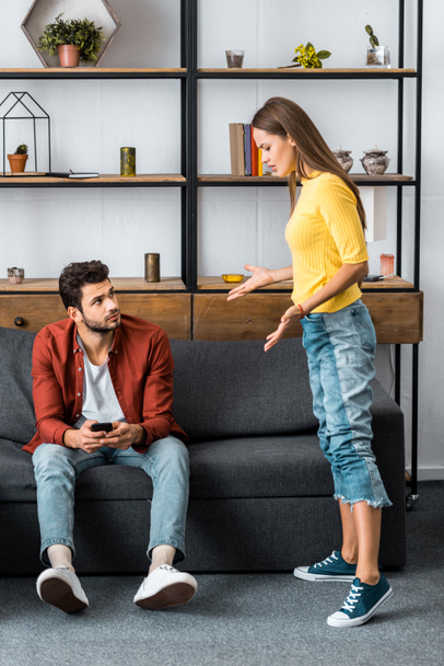 angry woman arguing with boyfriend in living room - Foto, immagini