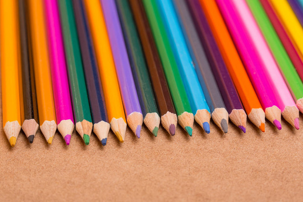 Wooden colorful pencils, on wooden table - Foto, Imagen