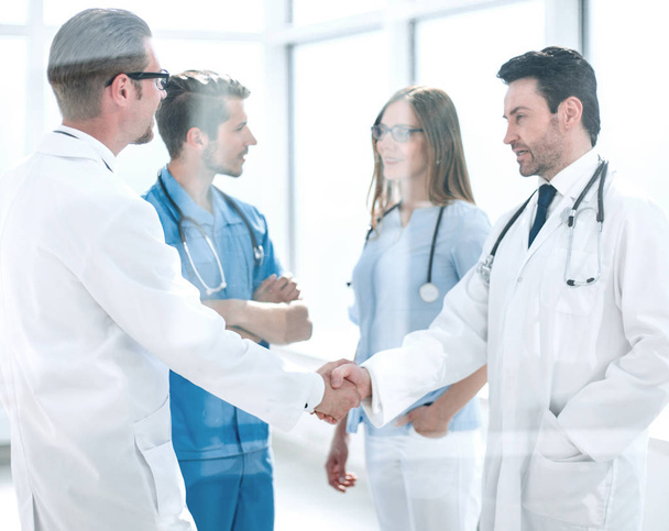 handshake colleagues in the hospital corridor - Photo, Image