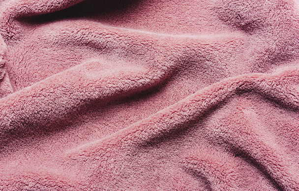 Pink soft fleece texture. The surface of a teddy crumpled microfiber rug - Zdjęcie, obraz
