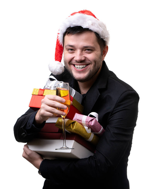 Photo of happy brunet in Santas cap with boxes with gifts, with terminal - Zdjęcie, obraz