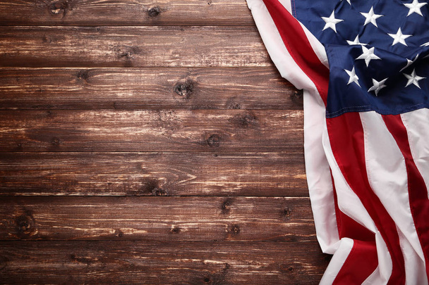 American flag on brown wooden table - Foto, Imagen