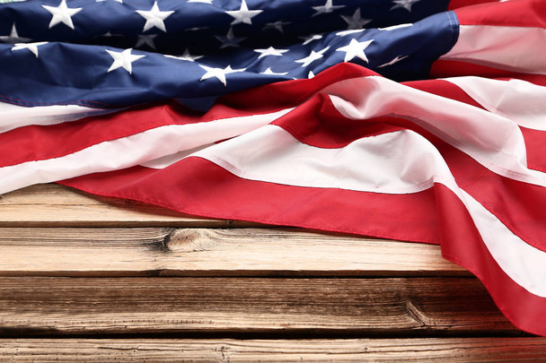 American flag on brown wooden table - Zdjęcie, obraz