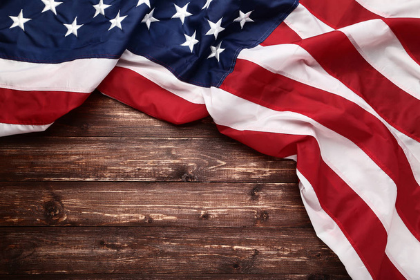 American flag on brown wooden table - Fotografie, Obrázek