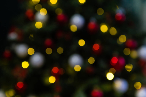 Blurred background with bokeh lights. Christmas and new year mood. - Fotó, kép