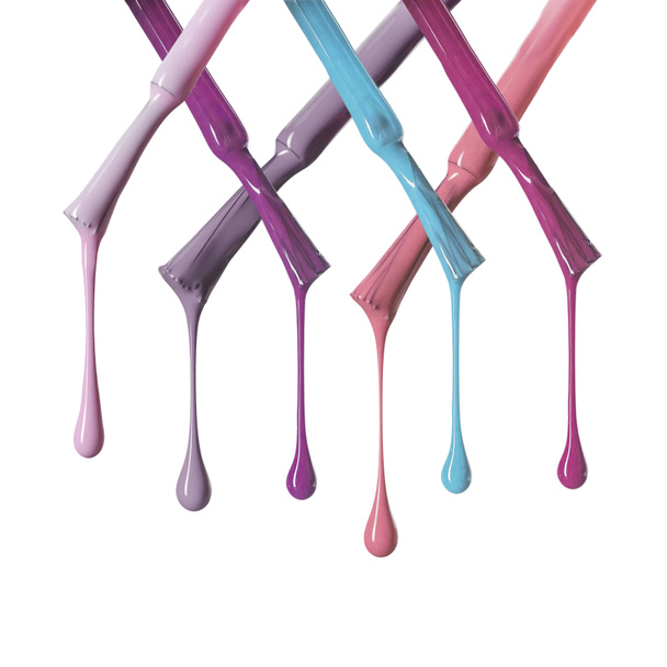 brushes with pastel dripping nail polish isolated on white - Photo, Image