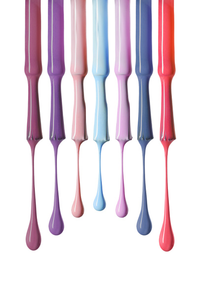 wet brushes with multicolored nail polish isolated on white - Фото, изображение